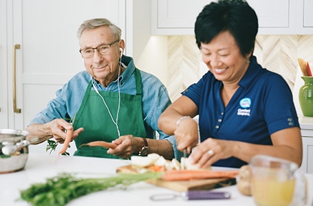 Caregiver Helping senior Cooking